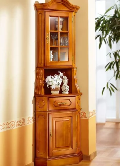 BADER Eckvitrine mit eleganten, goldfarbenen Metallgriffen